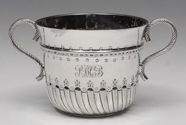 Appraisal: A TH CENTURY STYLE SILVER PORRINGER with scroll handles and