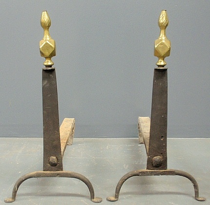 Appraisal: - Large pair of wrought iron andirons th c with