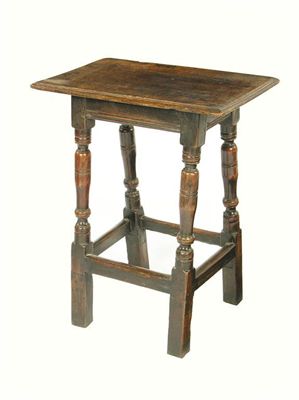 Appraisal: An oak joined high stool with a moulded edge top