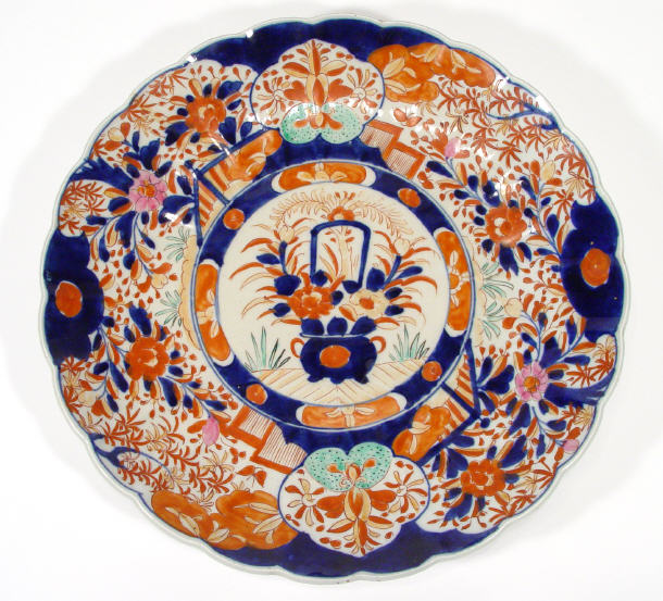 Appraisal: Large Japanese Imari fluted porcelain charger painted with a basket