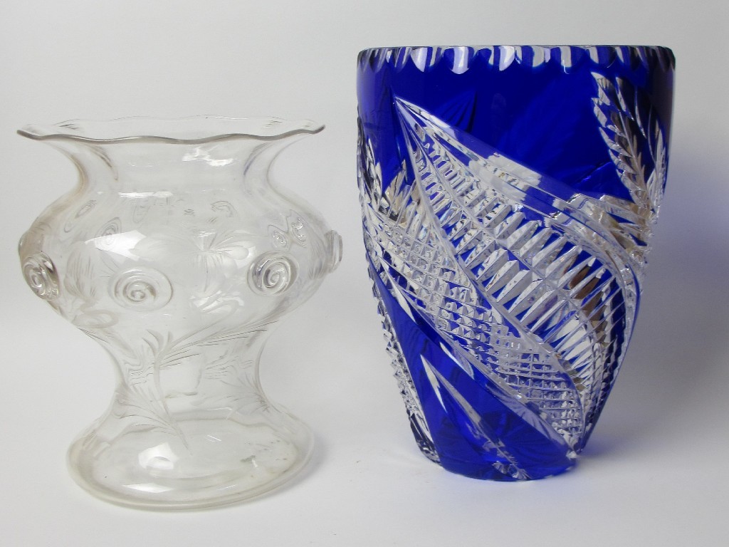 Appraisal: An engraved glass vase applied with swirls and a blue