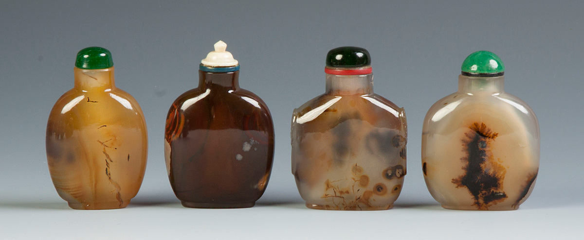 Appraisal: Four Chinese Agate Snuff Bottles One has carved sides handles