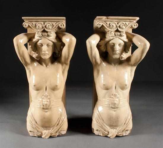 Appraisal: Pair of classical style glazed terracotta two-part caryatid groups with