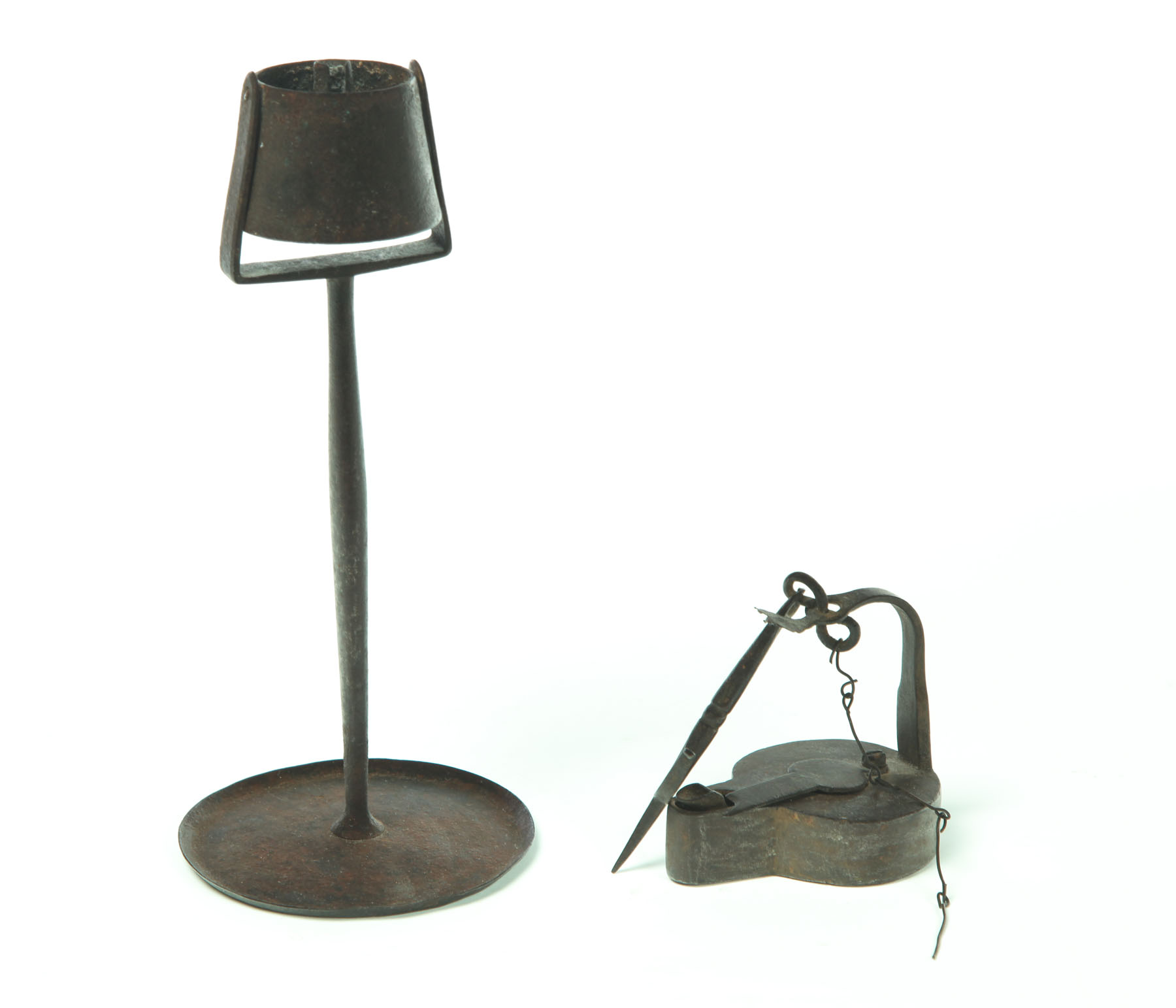 Appraisal: TWO LAMPS American th century wrought iron Betty lamp with