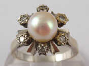 Appraisal: A white metal tests carat gold diamond and cultured pearl