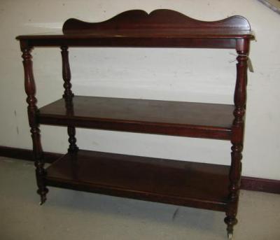 Appraisal: A VICTORIAN MAHOGANY THREE TIER BUFFET of rounded oblong form