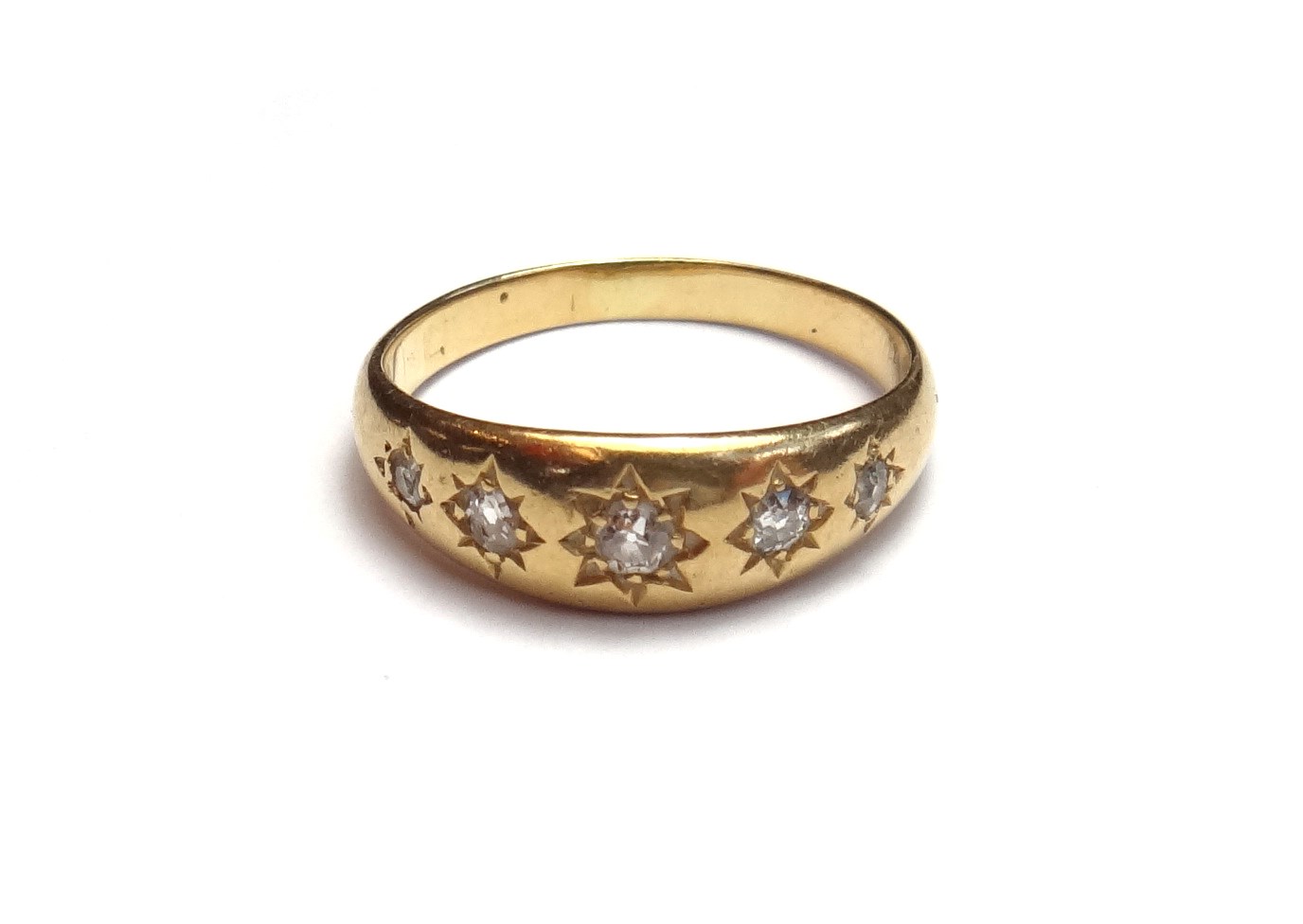 Appraisal: A gold and diamond set five stone ring star gypsy