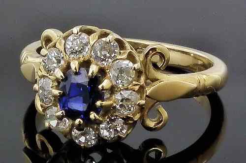 Appraisal: A modern ct gold mounted sapphire and diamond flowerhead pattern