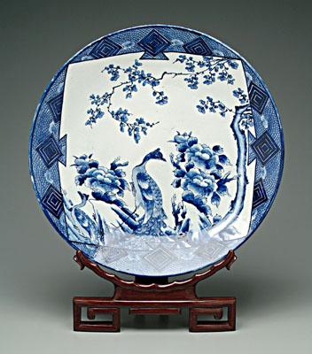 Appraisal: Japanese blue and white charger peacocks perched on rock beneath