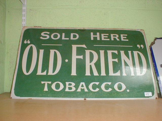 Appraisal: An enamel advertising sign - SOLD HERE OLD FRIEND TOBACCO