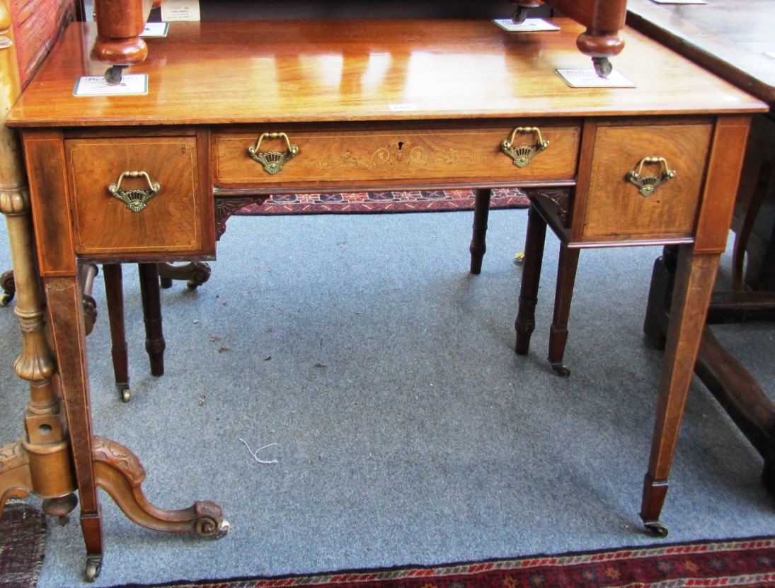 Appraisal: A late th century marquetry inlaid mahogany writing desk with