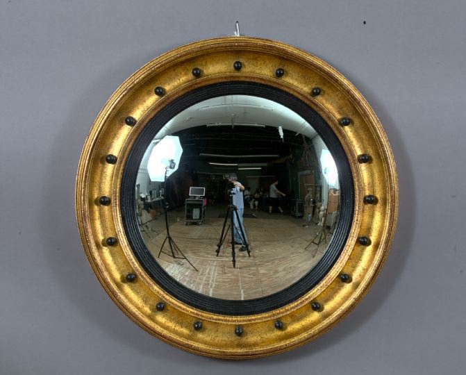 Appraisal: English Carved Parcel-Ebonized and Gilded Convex of Bull's-Eye Looking Glass