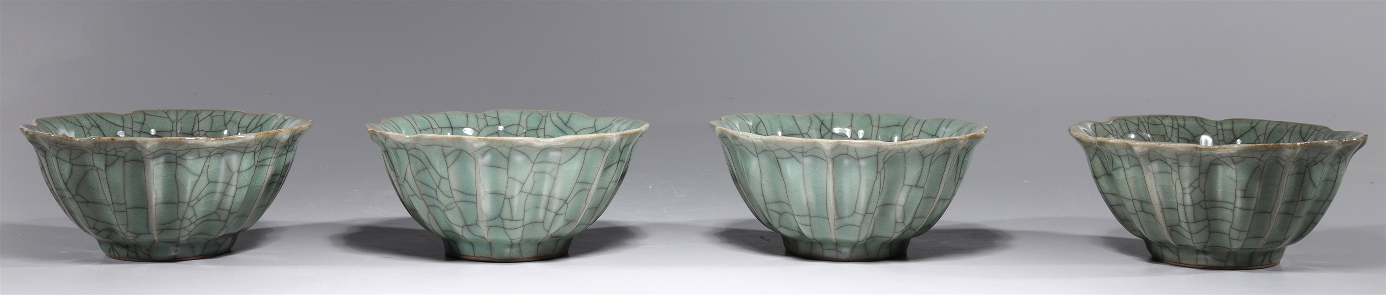 Appraisal: Four Chinese crackle glazed celadon porcelain bowls with fluted design