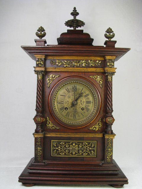 Appraisal: Antique wood mantel clock with brass ormolu accents Back cover