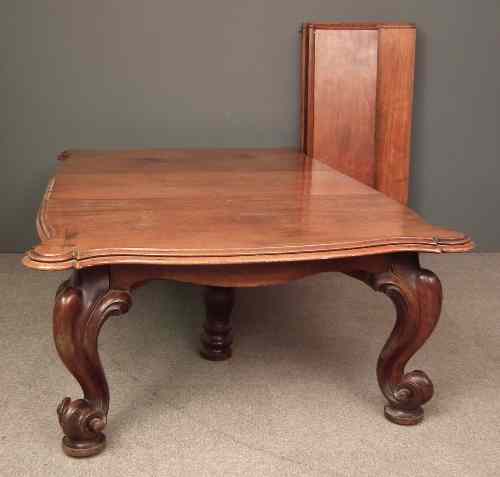 Appraisal: A Victorian Irish mahogany extending dining table with five extra