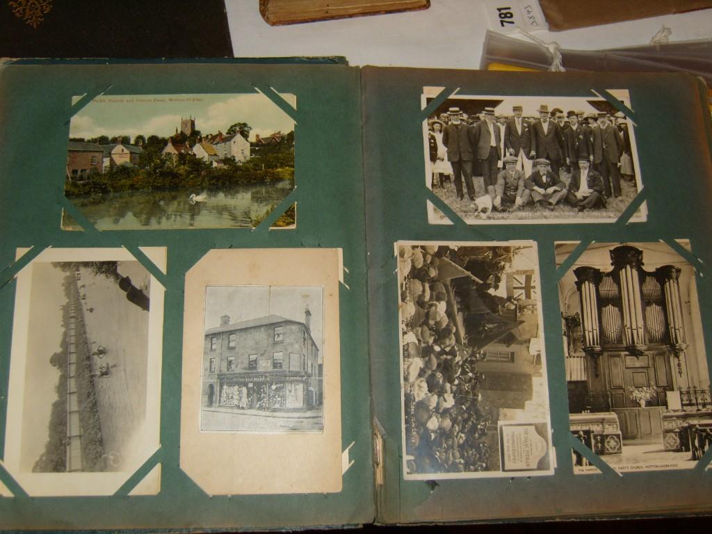 Appraisal: An early th century postcard album containing an interesting collection