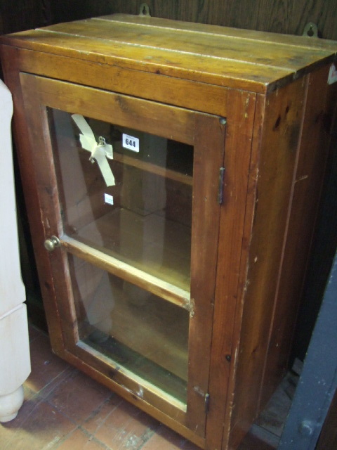 Appraisal: A th century stained pine hanging cupboard with single glaze