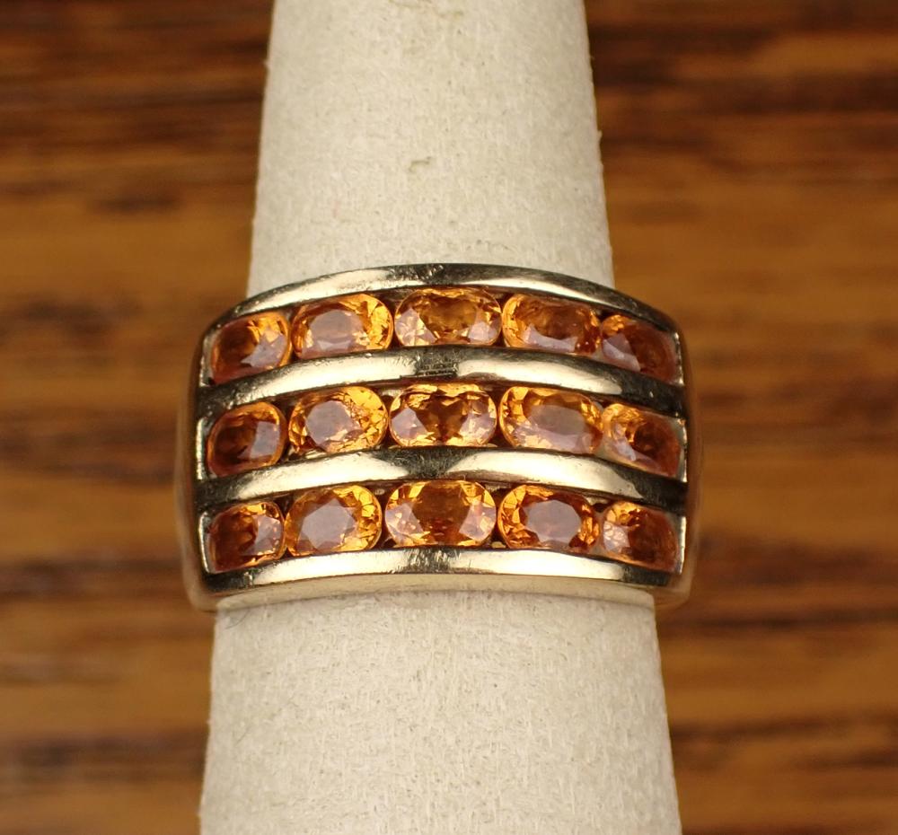 Appraisal: SPESSARTITE GARNET AND YELLOW GOLD RING The k gold ring