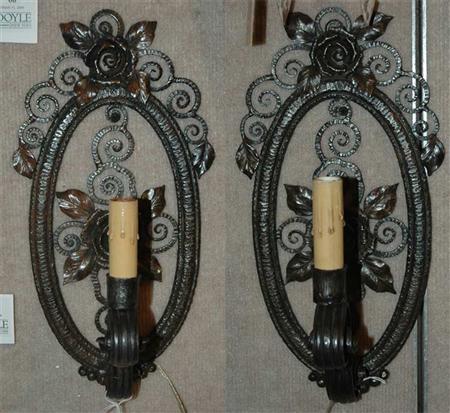 Appraisal: Pair of Floral Decorated Wrought Iron Sconces Estimate nbsp nbsp