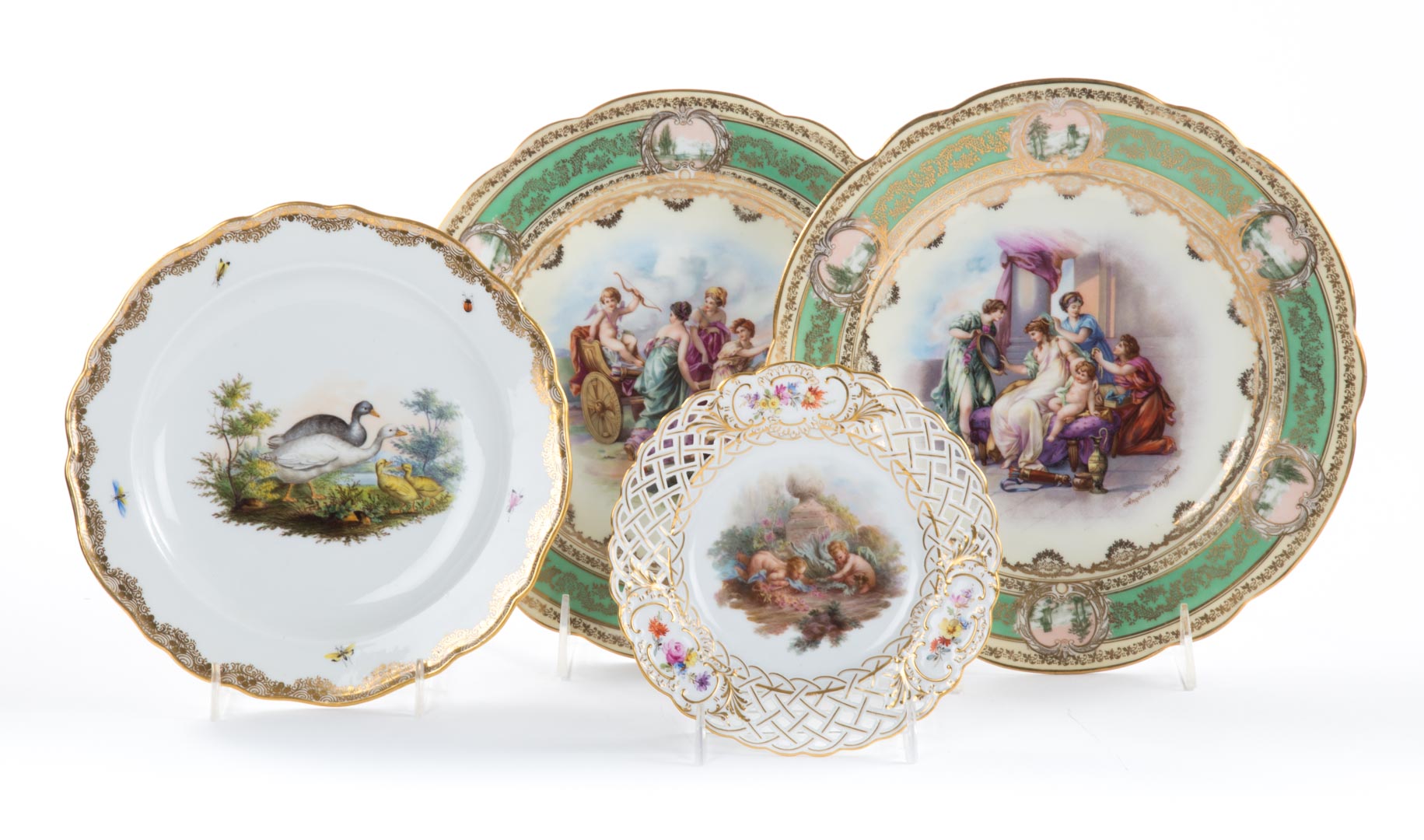 Appraisal: Two Meissen plates and two Vienna plates Meissen porcelain dessert