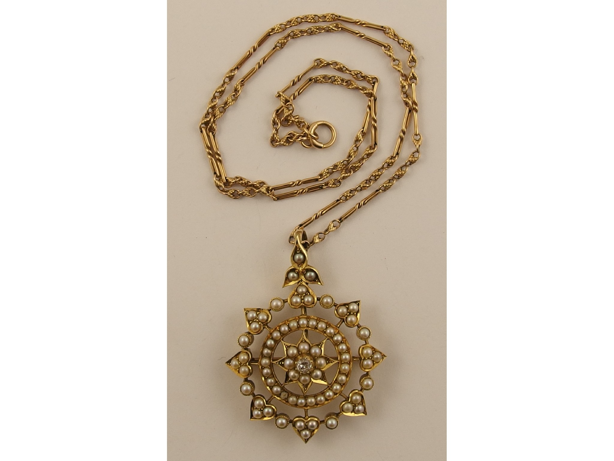 Appraisal: An Edwardian split pearl and diamond pendant broochwith a removable