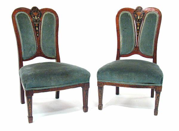 Appraisal: A pair of Edwardian inlaid mahogany low side chairs height