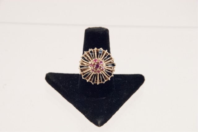 Appraisal: a K Cocktail Ring Seven ruby-like stones