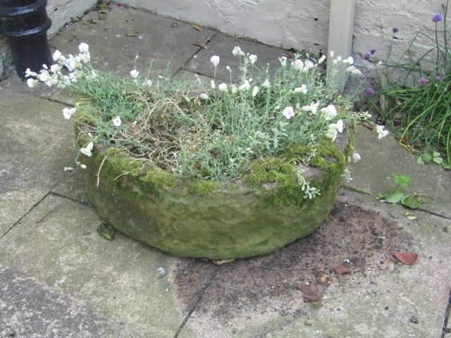 Appraisal: A hand hewn demi-lune stone trough cm wide