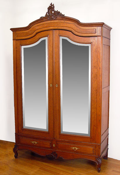 Appraisal: FRENCH LOUIS XV STYLE OAK DOUBLE DOOR ARMOIRE Beveled mirrors