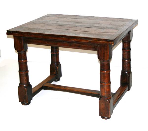 Appraisal: An English Baroque style oak draw leaf dining table height