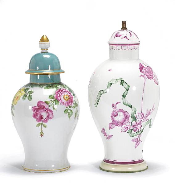 Appraisal: Two German porcelain hand-painted covered vases one now as table