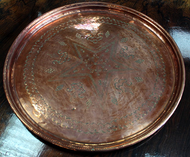 Appraisal: A LARGE POSSIBLY INDIAN COPPER TRAY with central star decoration