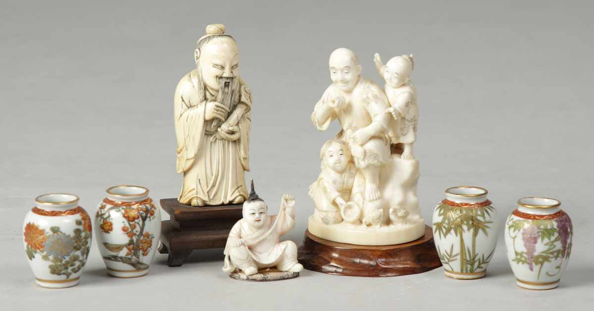 Appraisal: Carved Ivory Figural Group th th cent W Children feeding