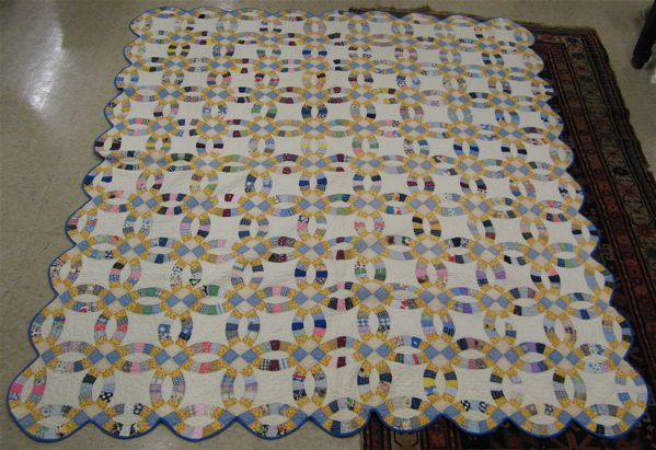 Appraisal: AN AMERICAN PIECED HANDMADE QUILT in the small Star pattern