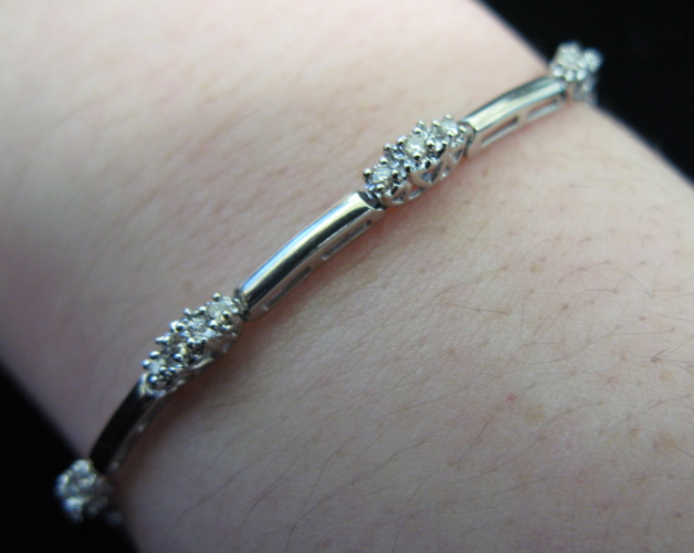 Appraisal: DIAMOND AND TEN KARAT WHITE GOLD BRACELET seven inches in