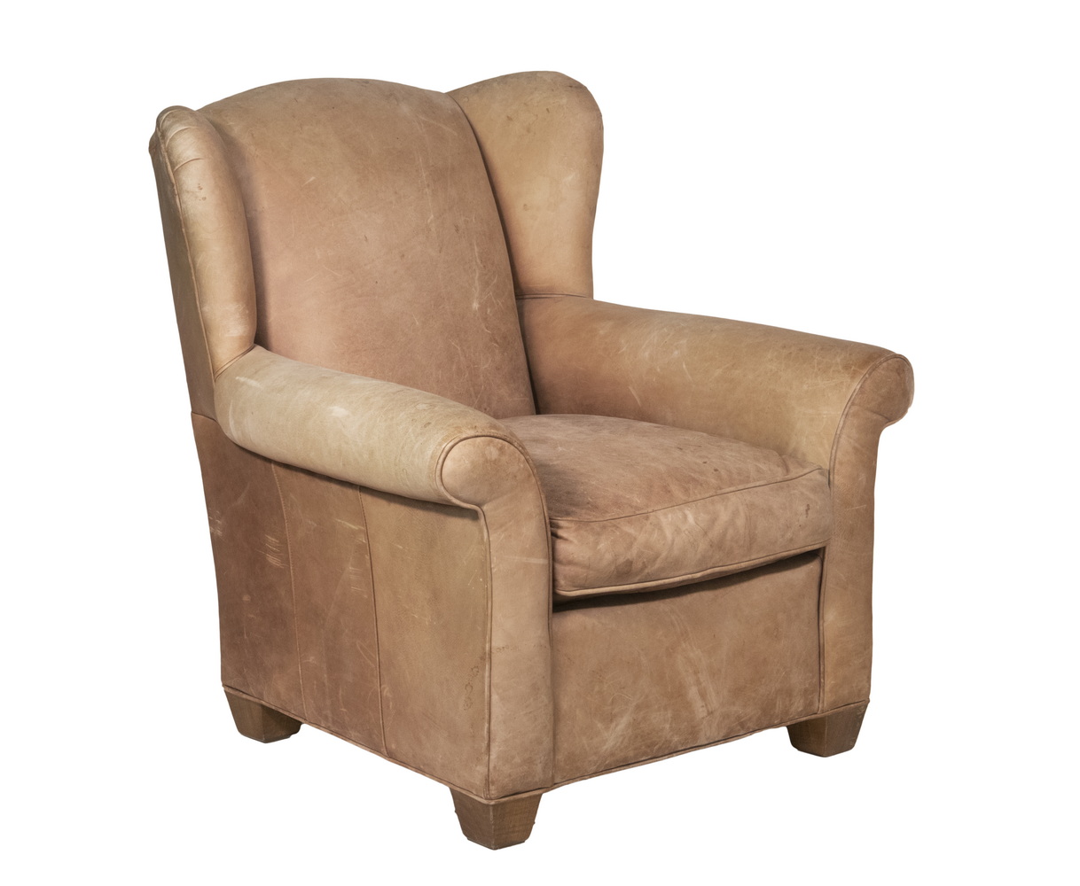 Appraisal: LEATHER OVERSTUFFED CLUB WINGCHAIR 's Tan Leather Wingchair by Mitchell