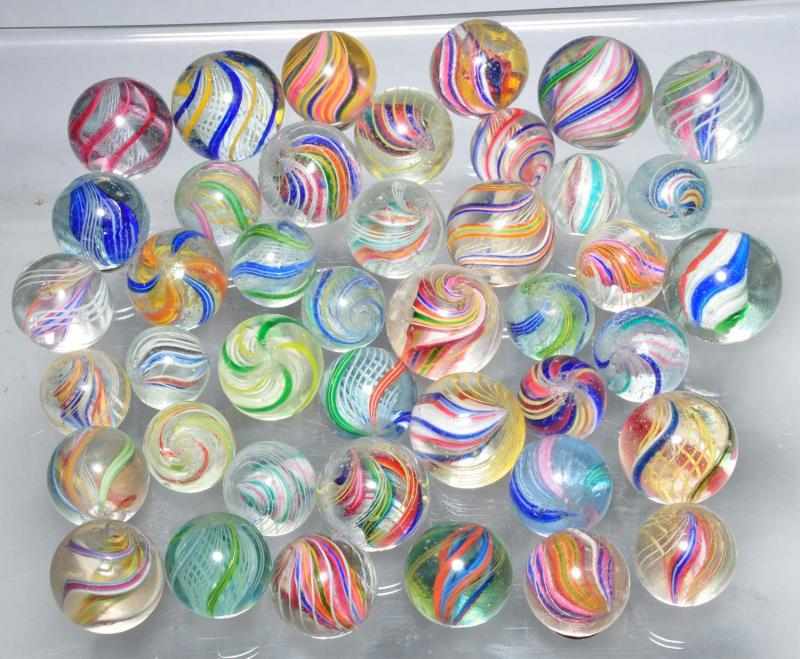 Appraisal: Lot of Assorted Swirl Marbles Description Includes divided core swirls