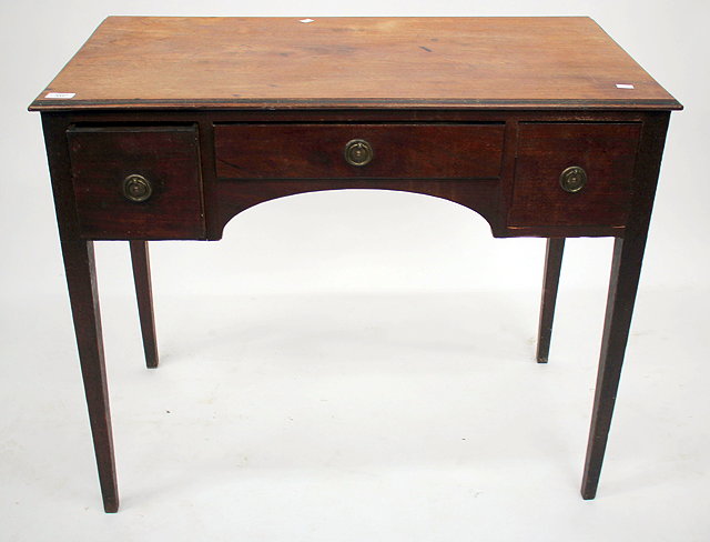 Appraisal: AN ANTIQUE MAHOGANY SIDE TABLE with three drawers standing on