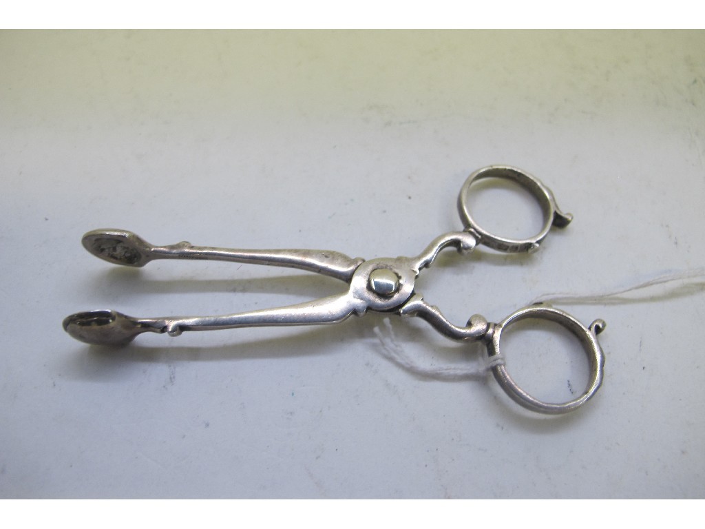 Appraisal: A pair of silver sugar nips Chester