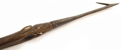 Appraisal: An oceanic harpoon the shaft carved a crocodile head with