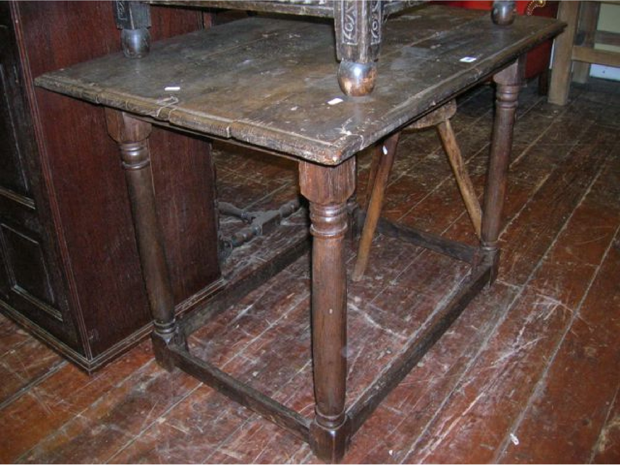 Appraisal: A simple old English oak side table of rustic form