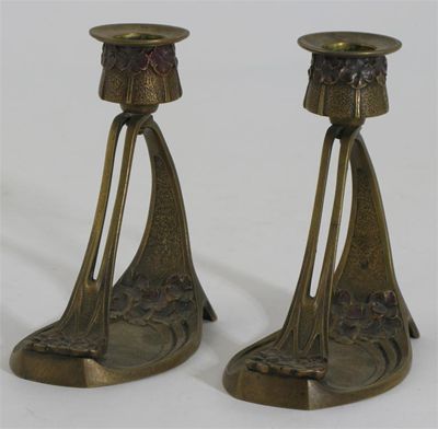 Appraisal: A pair of Continental Art Nouveau candlesticks each cast with