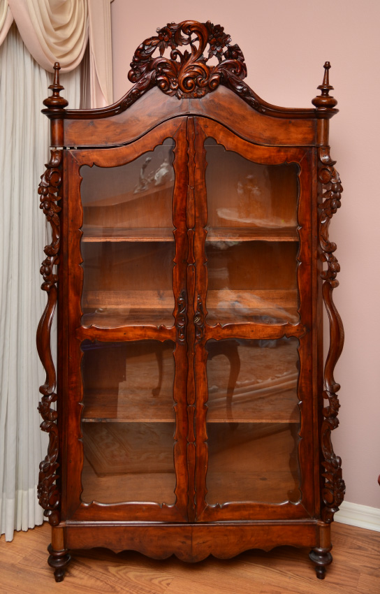 Appraisal: CARVED VICTORIAN CURIO CABINET Arched pediment with foliate scroll crest