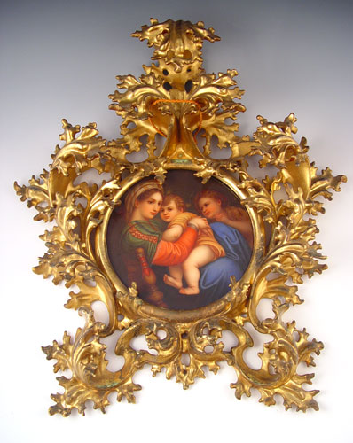 Appraisal: ORNATE GILDED AND CARVED GESSOWOOD FRAME WITH PAINTED ITALIAN PORCELAIN