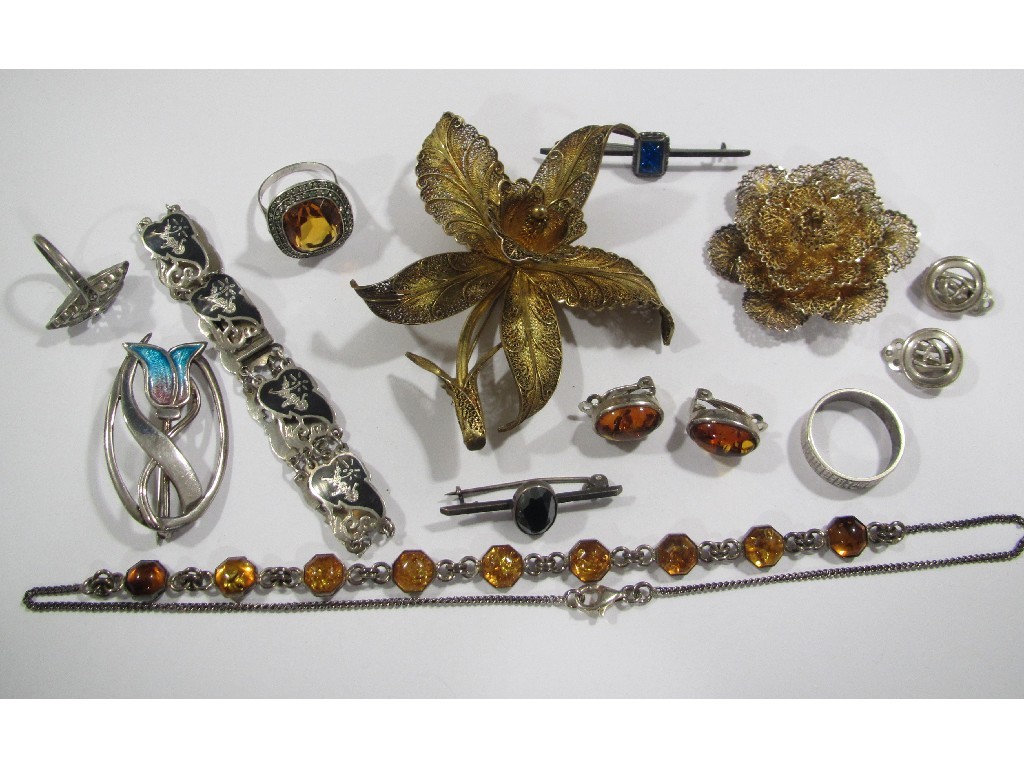 Appraisal: Lot comprising two silver filigree flower brooches amber and silver