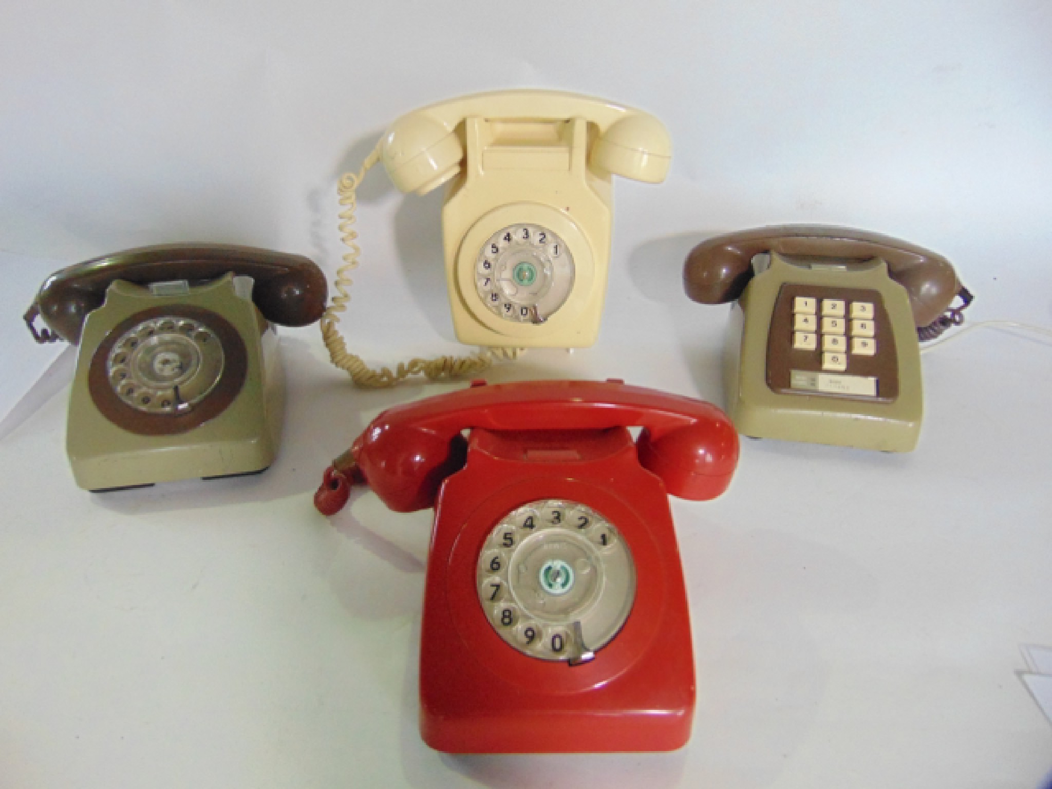 Appraisal: A selection of four Bakelite telephones to include a red