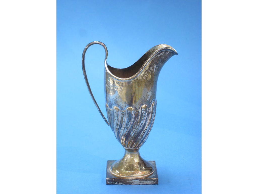 Appraisal: An Edward VII helmet shape Cream Jug spirally fluted on