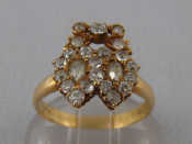 Appraisal: A yellow metal tests carat gold diamond ring designed as