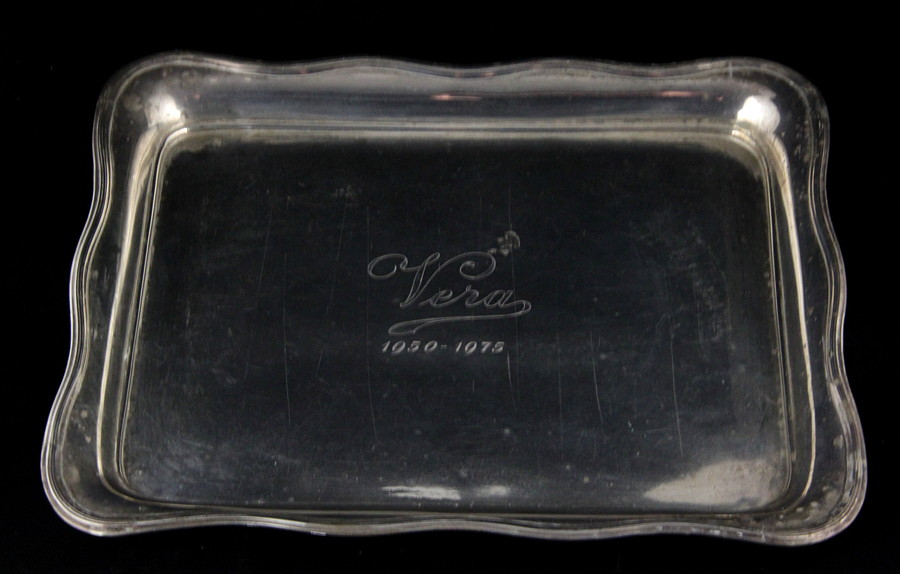 Appraisal: A silver tray marks rubbed of oblong shape with a