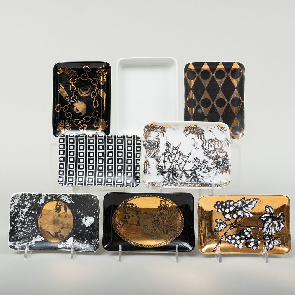 Appraisal: Group of Eight Fornasetti Porcelain Rectangular Dishes Black or gilt